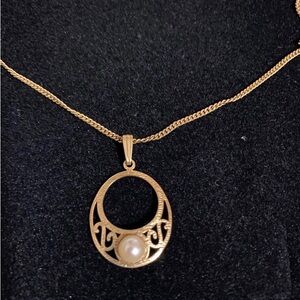 Faux pearl and gold toned pendant necklace